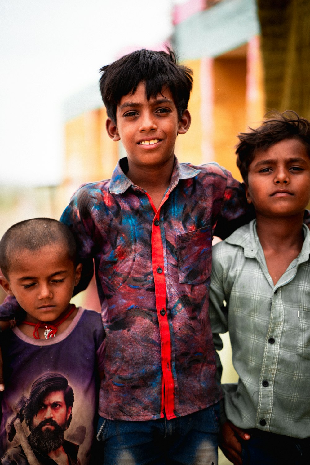 a group of young boys standing next to each other