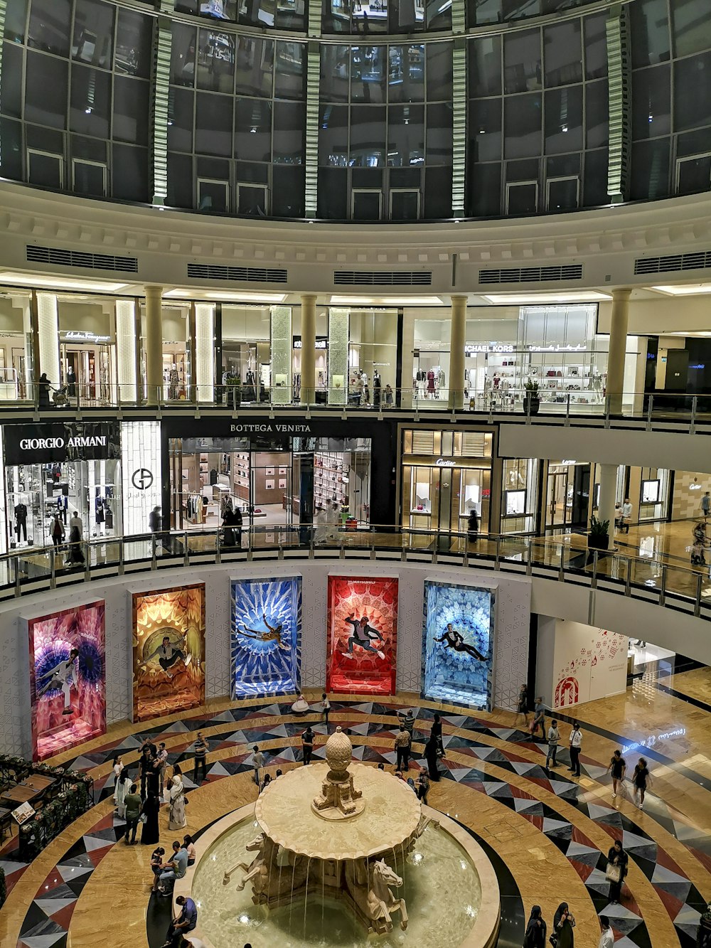 a mall filled with lots of people walking around