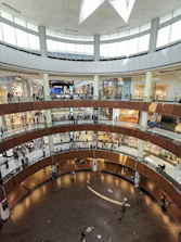 an overhead view of a shopping mall with people walking around