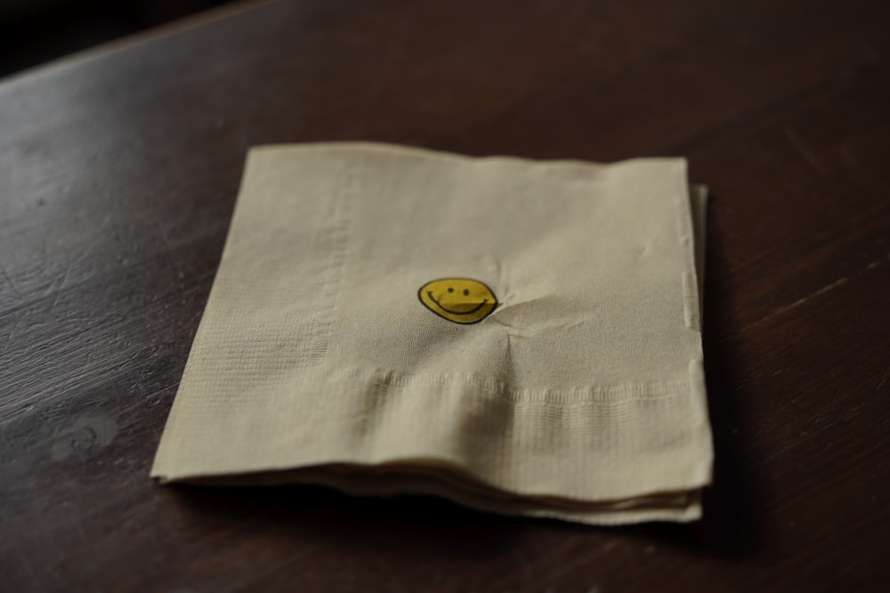 a napkin with a smiley face on it