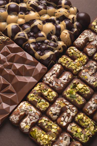 a table topped with lots of different types of chocolate