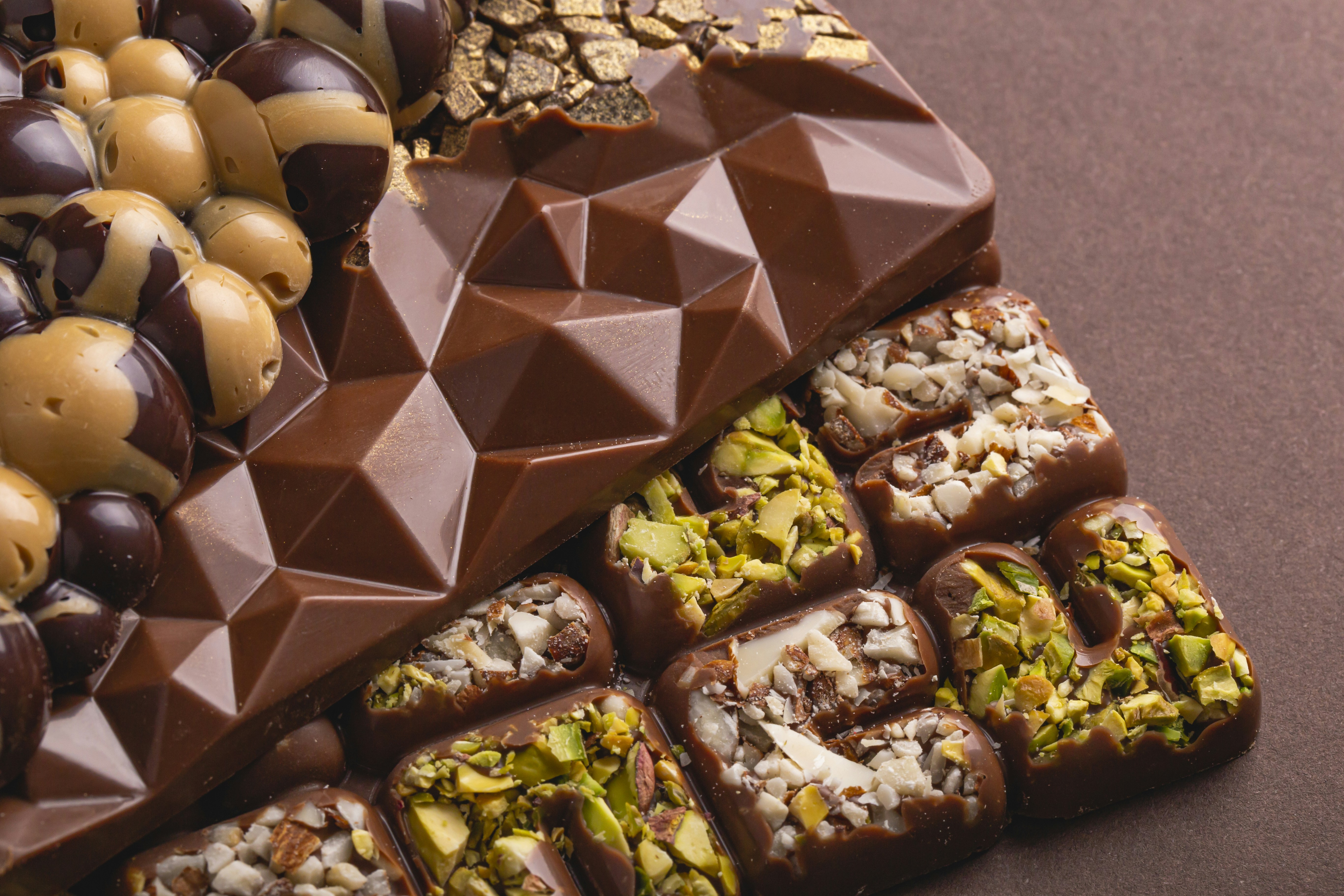 a variety of chocolates and nuts on a table
