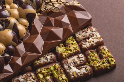 a variety of chocolates and nuts on a table