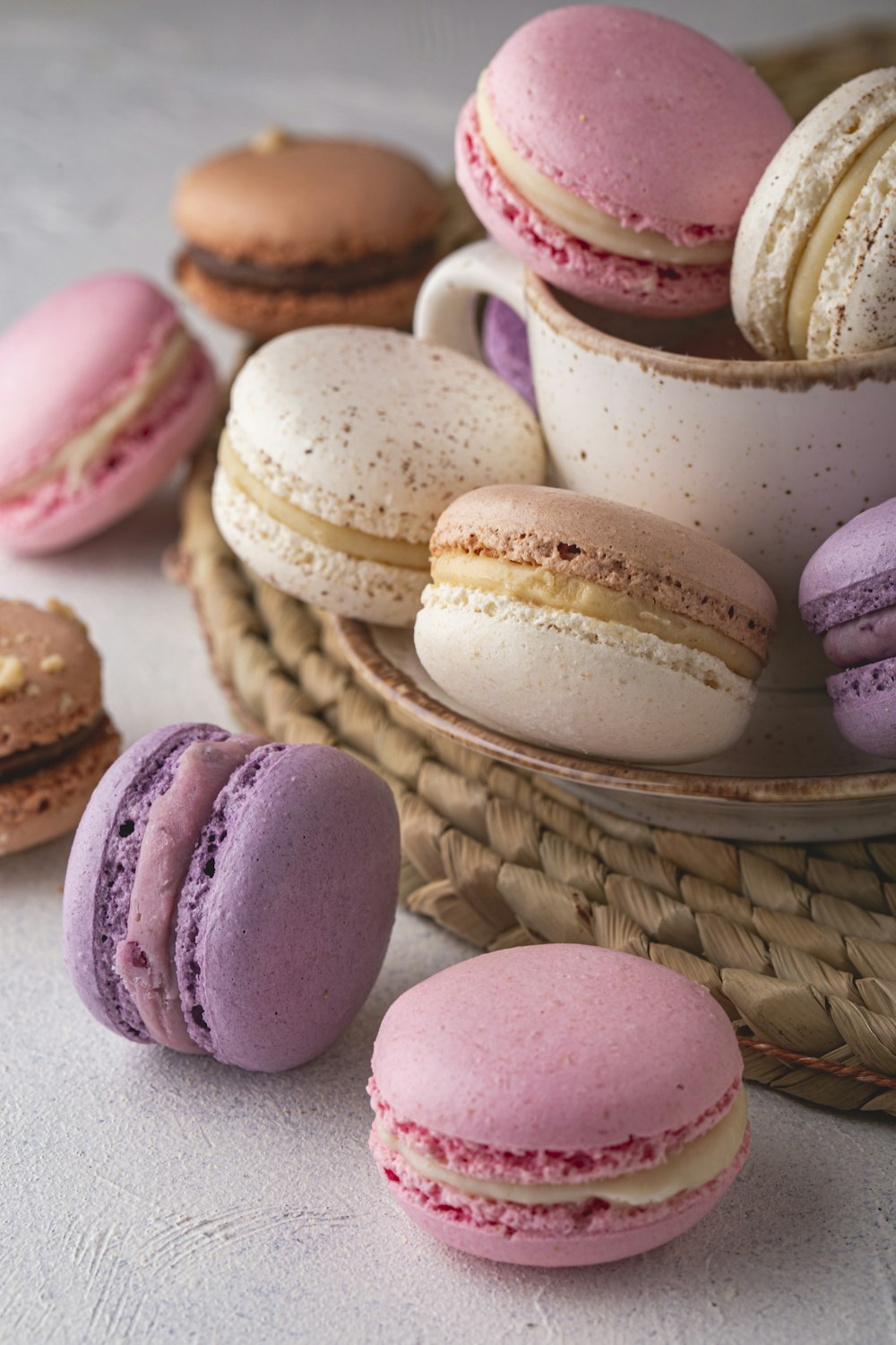 a basket filled with lots of different colored macaroons
