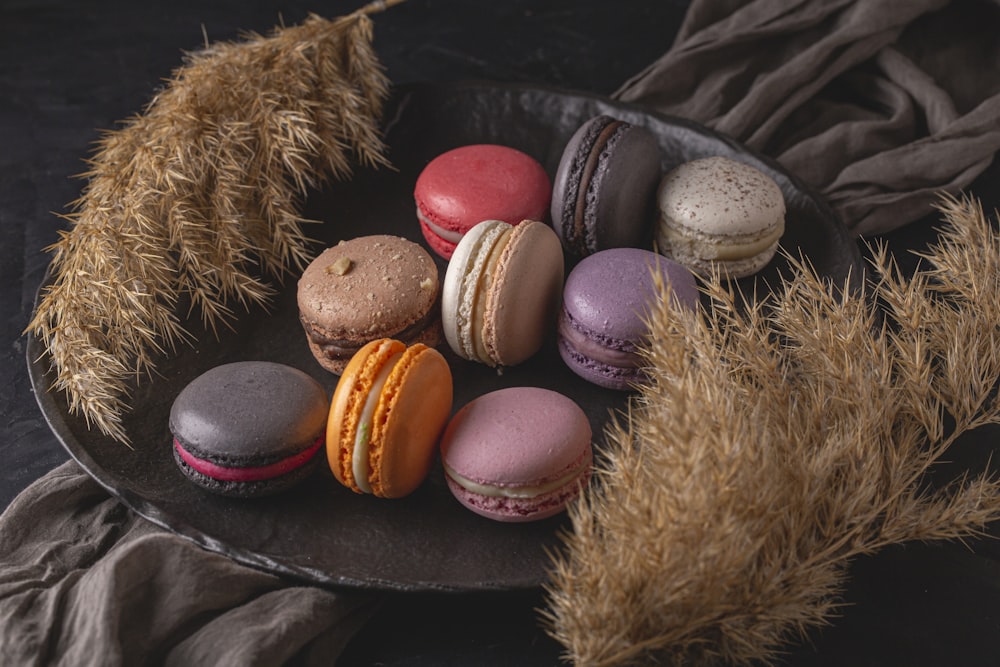 a plate of macaroons sitting on a table