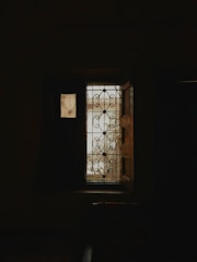 A stylish residential window featuring Sun Saver's perforated vinyl.