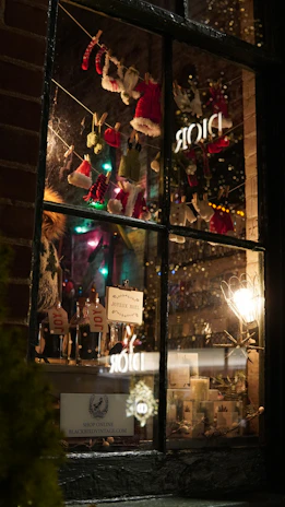 Cozy winter clothing display in a warmly lit boutique setting.