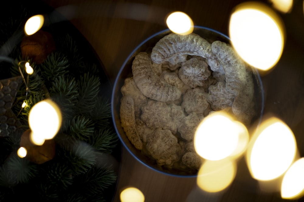 a bowl of cookies sitting on top of a table