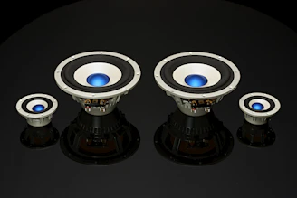 A set of high-end speakers with rich textures and saturated blue tones.