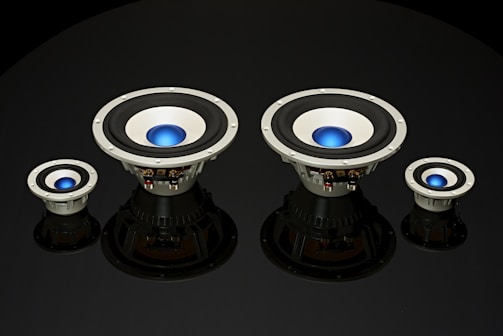 Dynamic photo of a subwoofer installation in progress with tools and glowing LED accents.