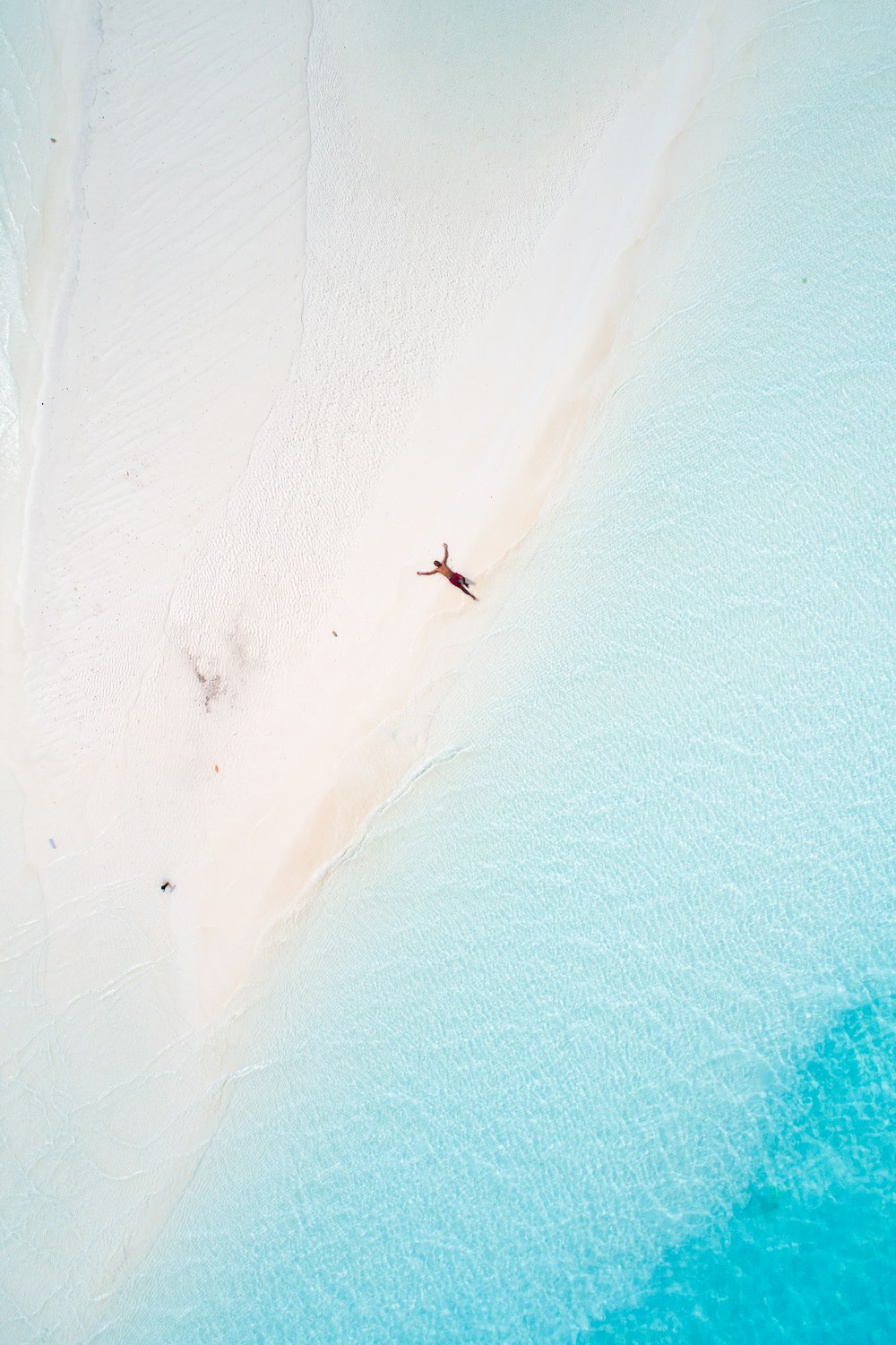 an aerial view of a person on a beach