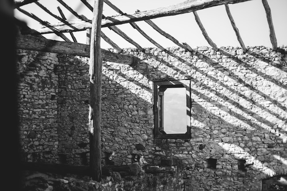 a stone building with a window in the middle of it