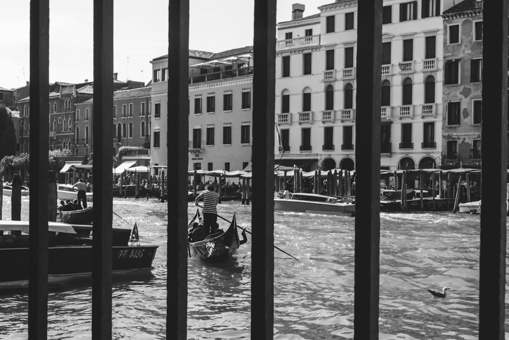 a black and white photo of some boats in the water