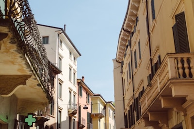 Front view of the historic Farmacia Scanno building bathed in soft morning light.