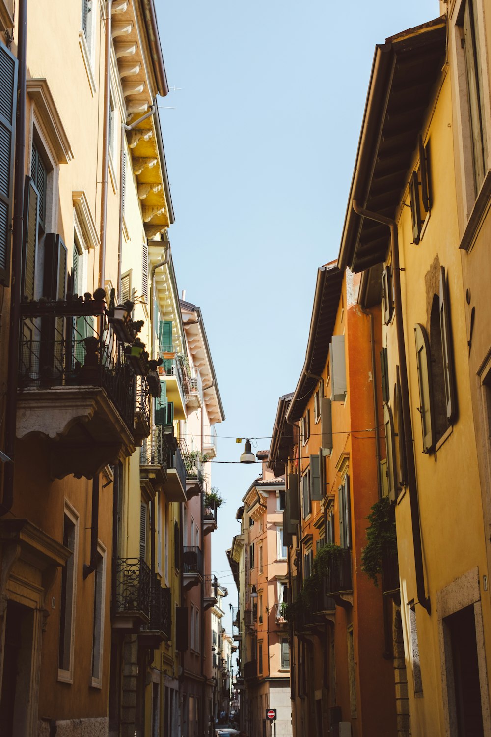 a narrow city street lined with tall buildings