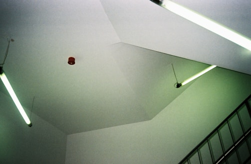 a room that has some lights on the ceiling