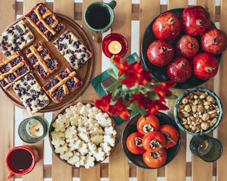 a wooden table topped with plates of food