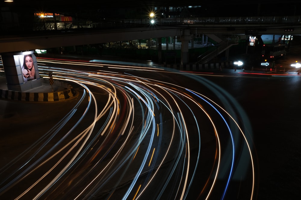 a picture of a woman on a billboard at night