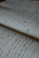 a close up of a very old writing paper