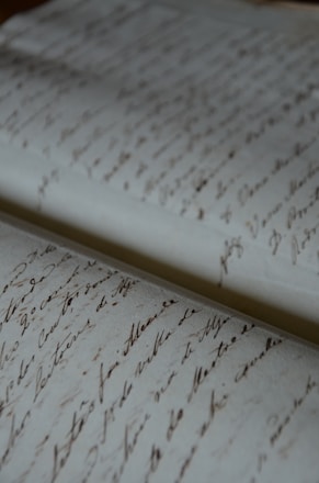 a close up of a very old writing paper