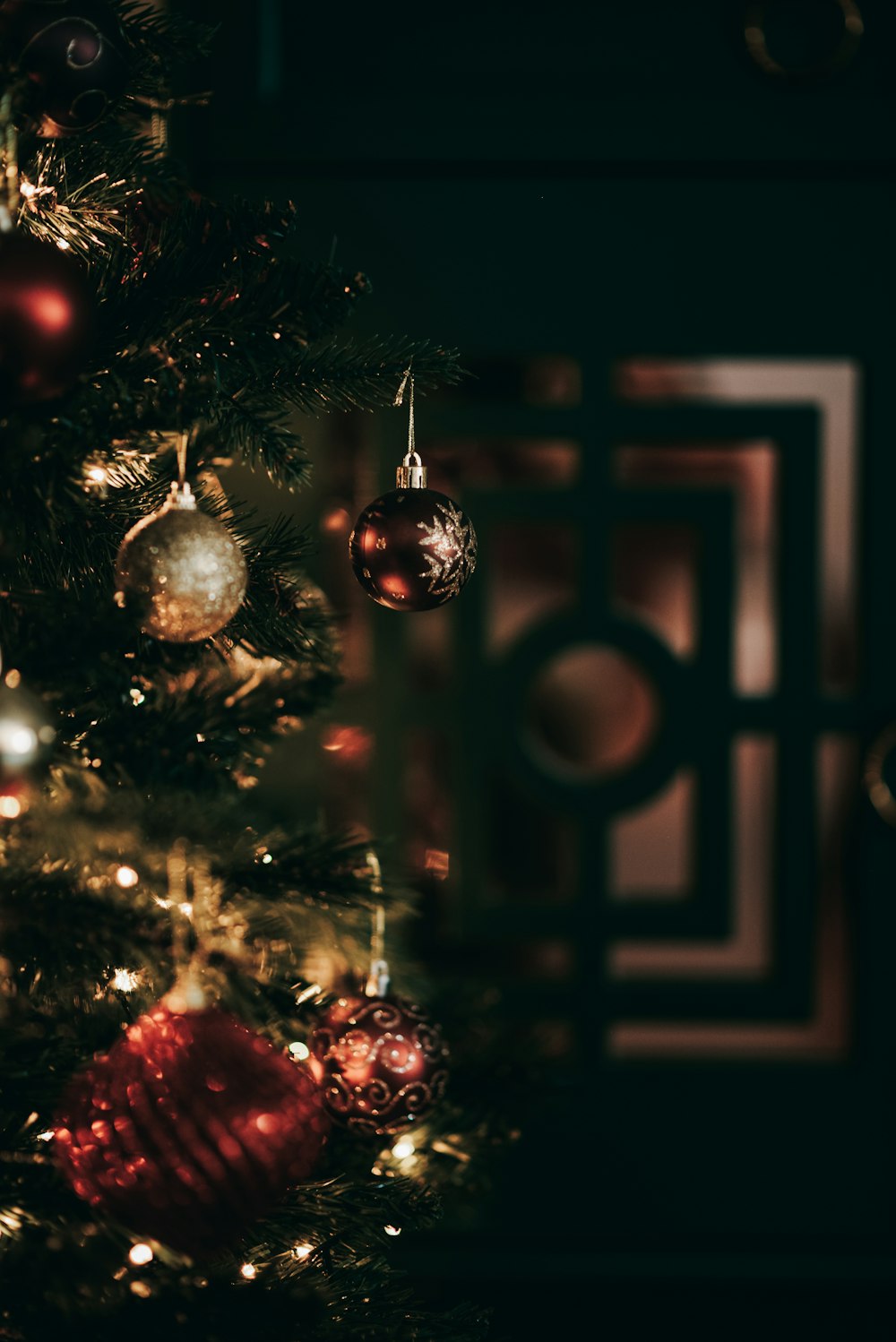 a close up of a christmas tree with ornaments