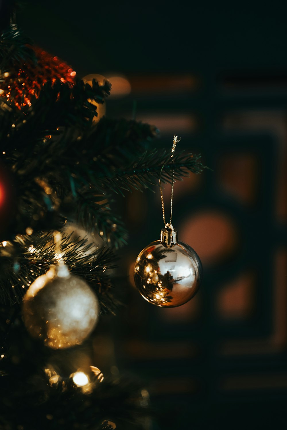 a close up of a christmas tree with ornaments