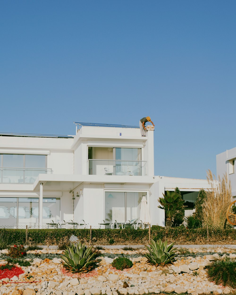 a large white house sitting on top of a hill