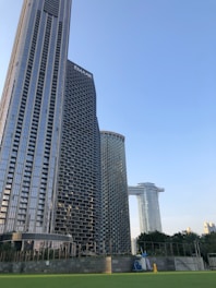 Architects reviewing detailed blueprints against the backdrop of a modern Bangkok skyline.