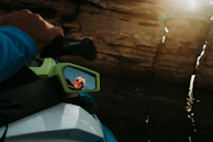 Close-up of a jet ski’s handle and dashboard glistening with sea spray.