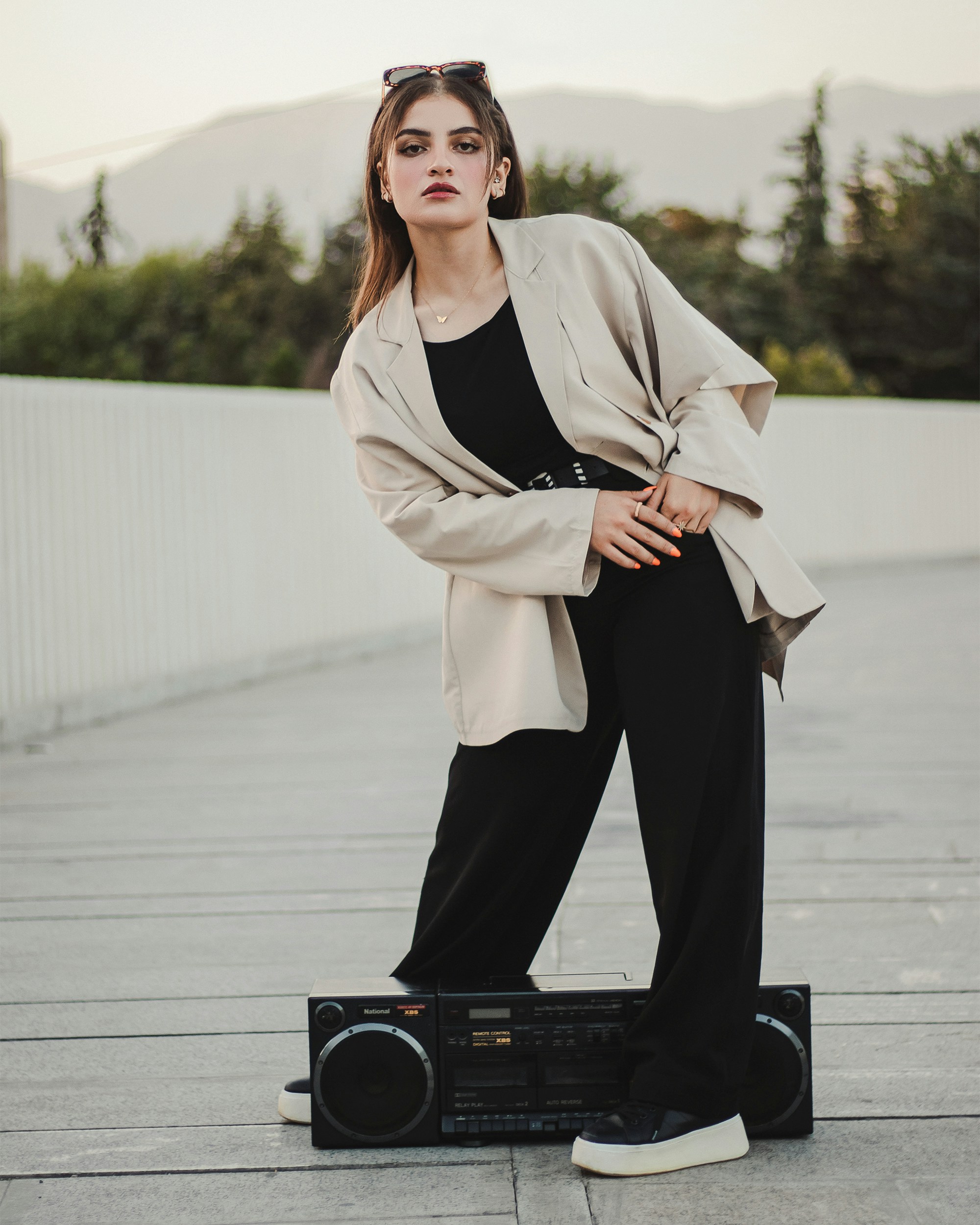 a woman standing on top of a radio