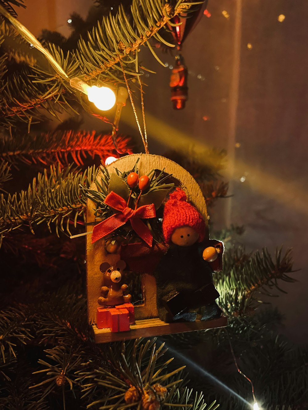 a christmas ornament hanging from a christmas tree