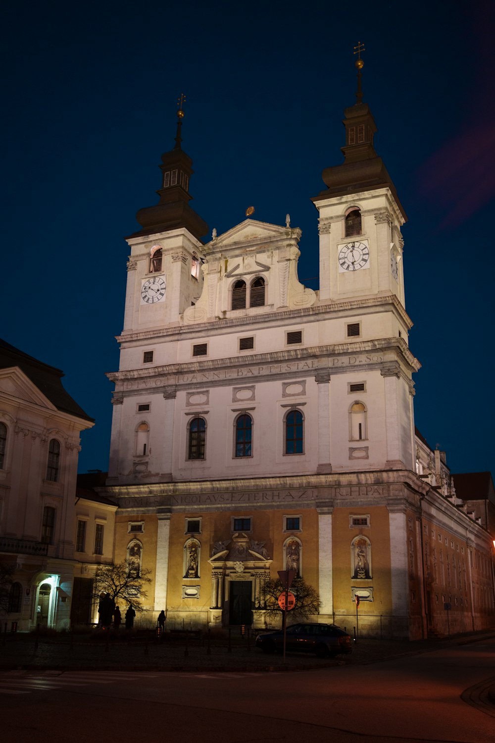 a large white building with a clock on it's side