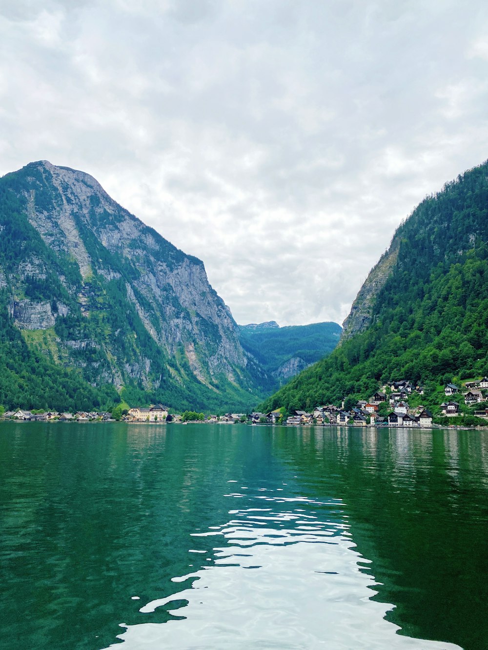 a body of water with mountains in the background