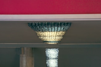 Close-up of matte metallic accents on a sleek, custom-designed interior fixture reflecting subtle light.