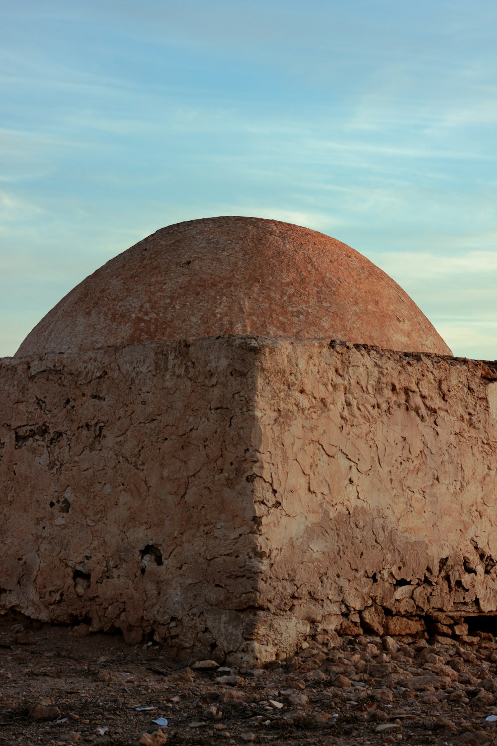 a large stone structure sitting in the middle of a desert