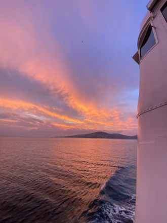 A beautiful sunset view from the deck of a yacht.