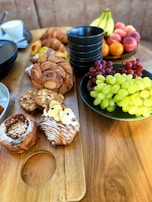 An assortment of pastries on a wooden serving board.