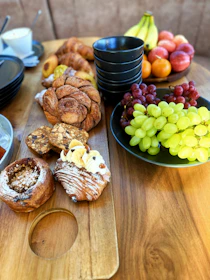A beautifully arranged platter of assorted breads and pastries ready for a corporate meeting.