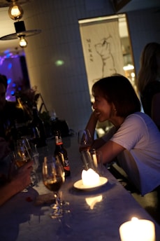A dimly lit Tokyo bar with a mysterious woman smiling subtly at the counter.