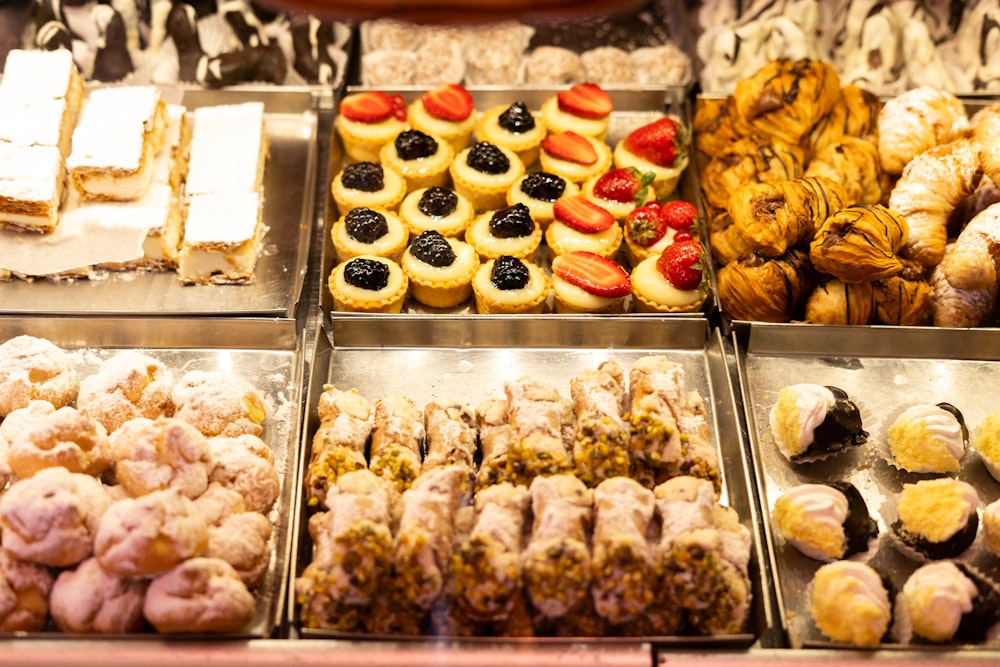 a display case filled with lots of different types of pastries