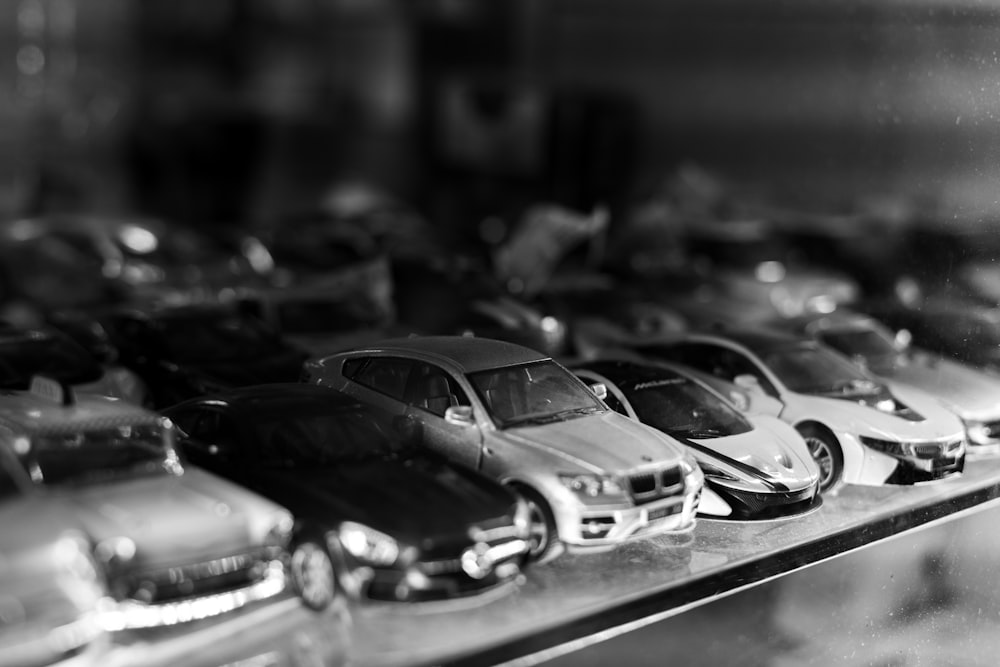 a row of toy cars sitting on top of a table