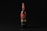A wine bottle with a black and red label stands upright against a dark background. The label features intricate typography and design elements, with the word 'Вино' prominently displayed.