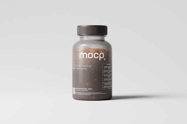 A transparent brown plastic pill bottle with a dark cap is placed against a light gray background. The label on the bottle reads 'mocp' and includes additional text and a website link at the bottom. The bottle's contents appear to be small brown pills.