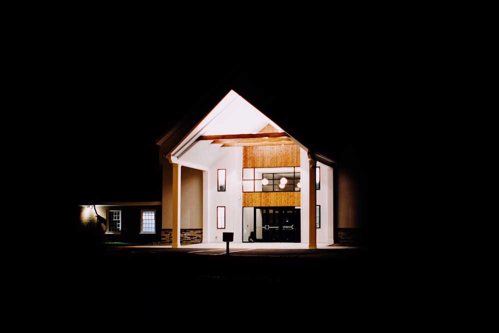 a house is lit up in the dark