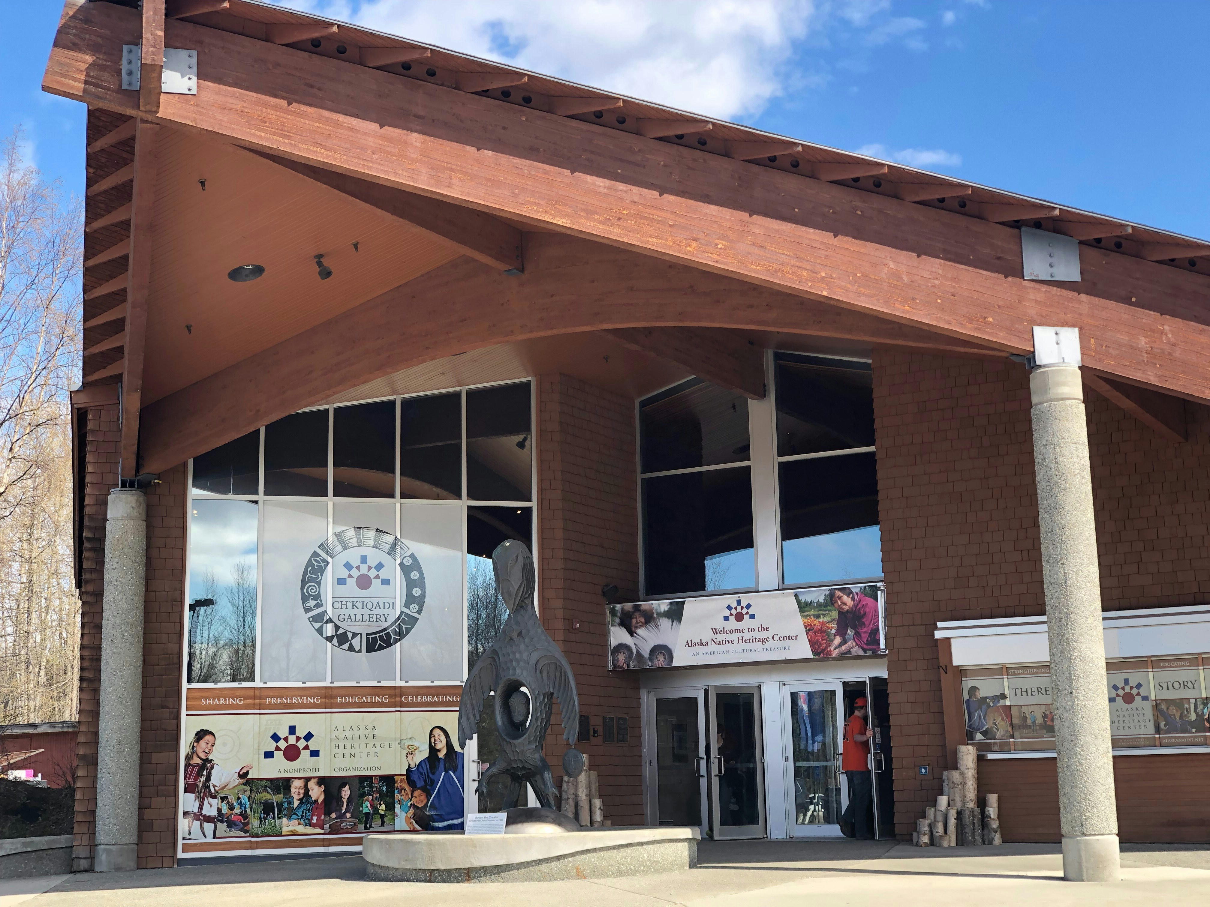 a building with a statue of a horse in front of it, Alaska Native Heritage Center