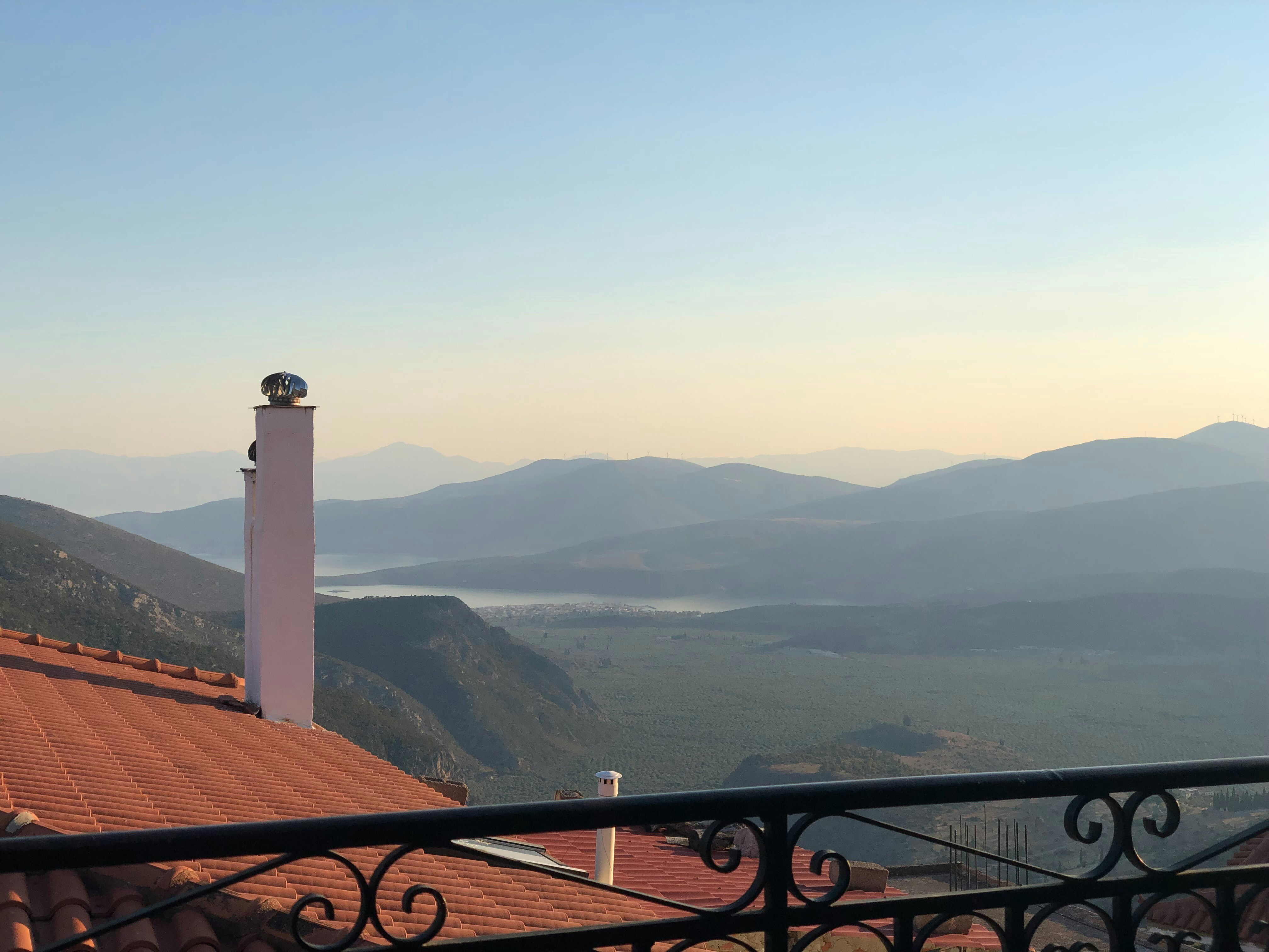 a view of a mountain range from a balcony