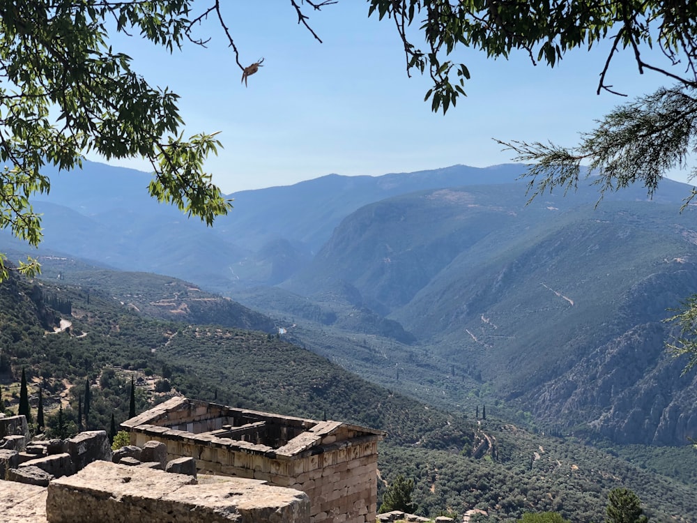 a view of a valley with mountains in the background