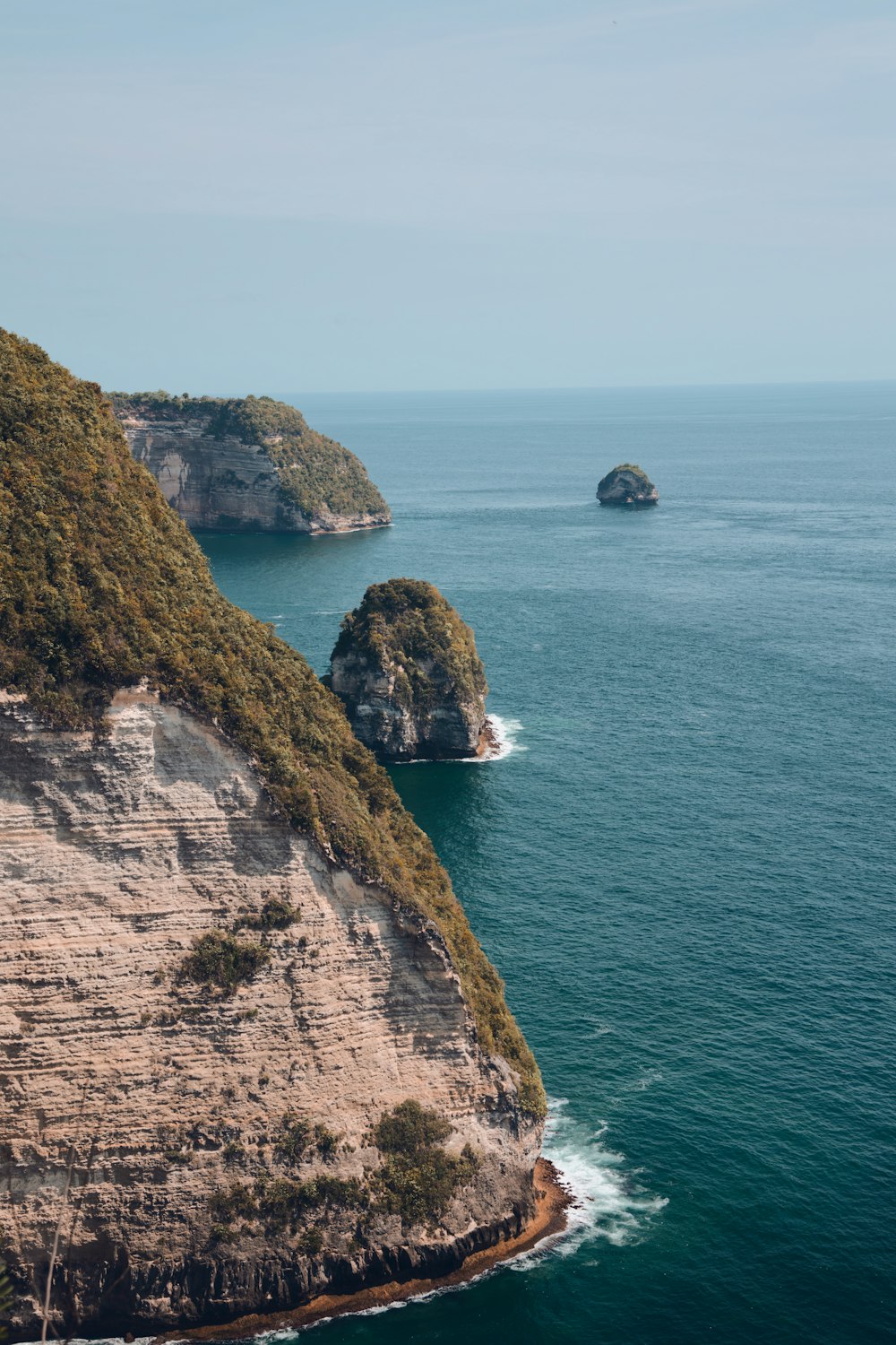 a view of the ocean from the top of a cliff