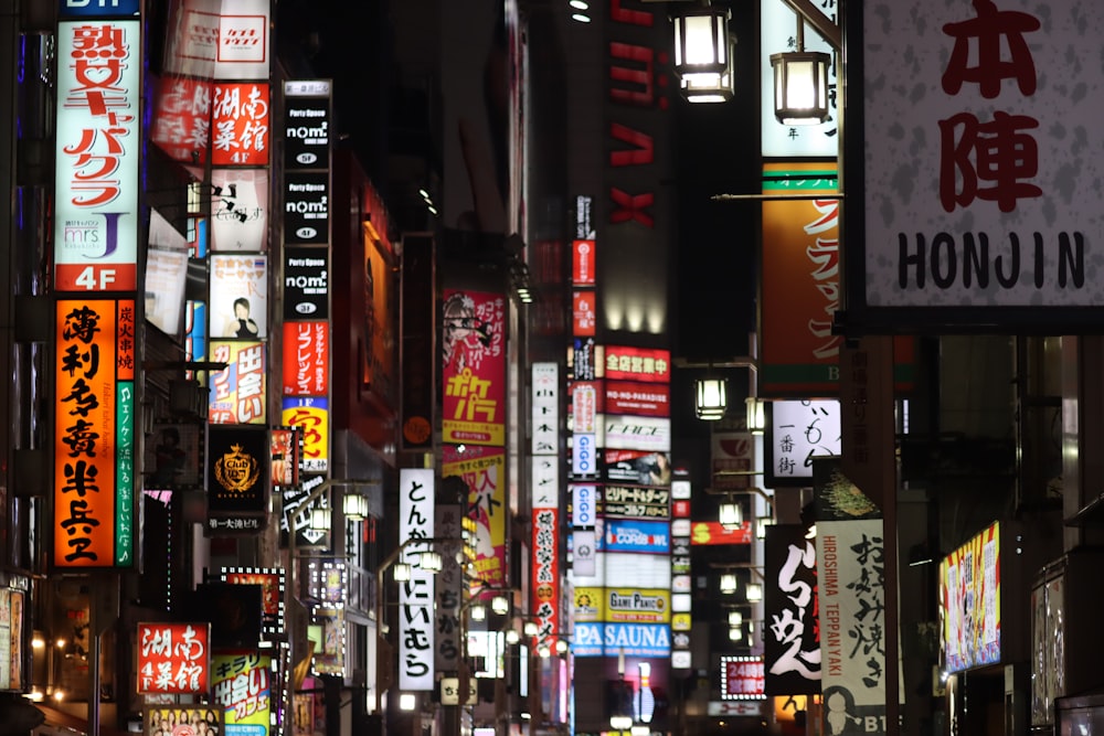 a city street filled with lots of neon signs