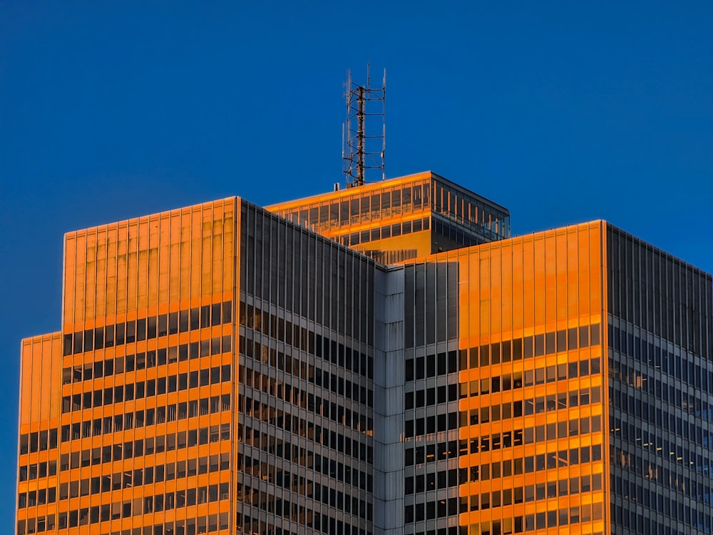 a very tall building with a very tall clock on it's side